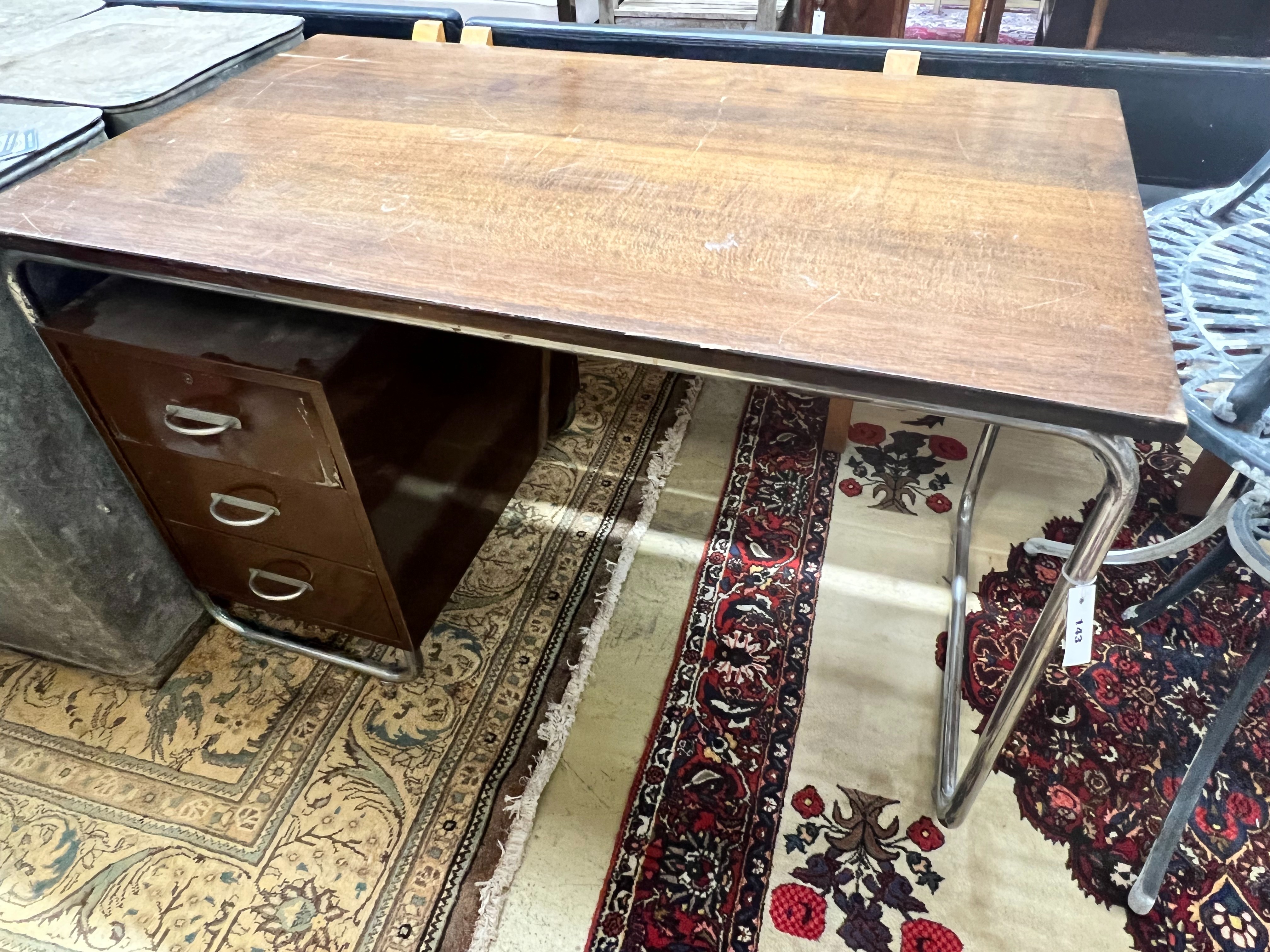 A modernist metal and beech kneehole desk, width 120cm depth 70cm height 75cm